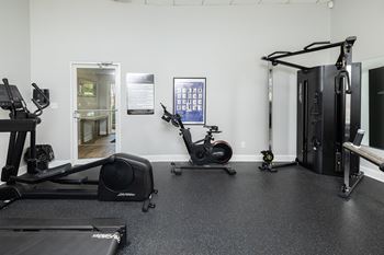 Fitness center with exercise bike and cable machine